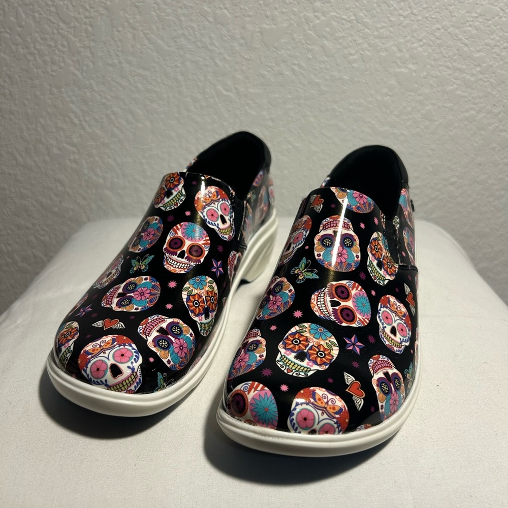 Women’s size 7 KLOGS “Ascent” slip-ons in Candy Skull Patent pattern